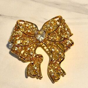 Smithsonian Institute vintage gold tone with rhinestone crystal bow brooch